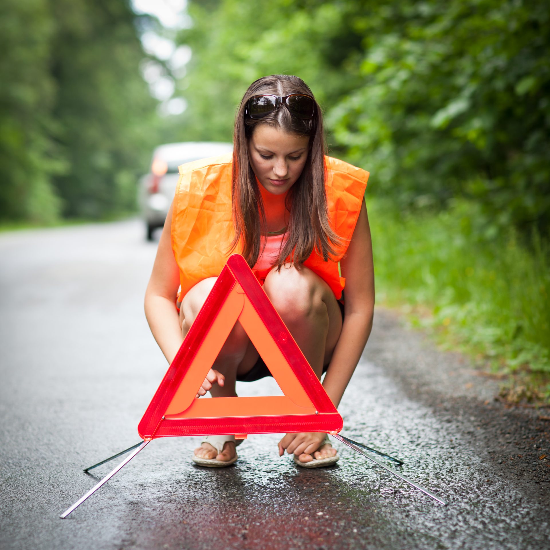 young-female-driver-wearing-a-high-visibility-vest-2023-11-27-05-29-06-utc